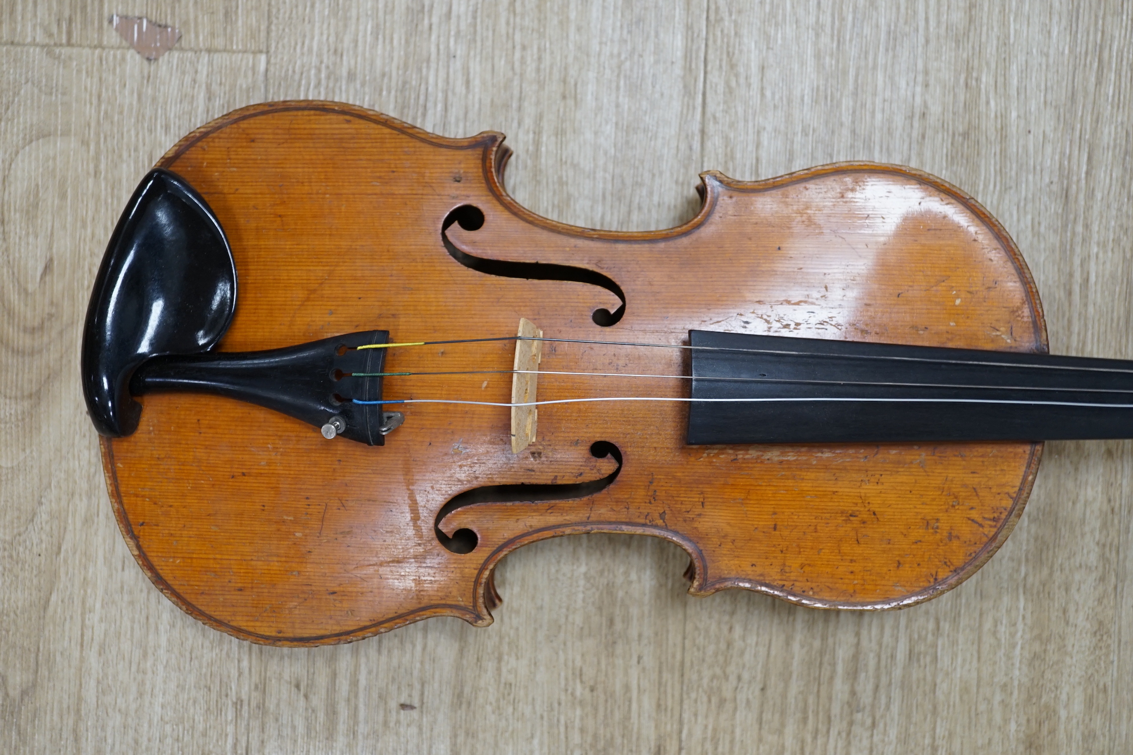 An uncased early 20th century violin, length of body 35.5cm